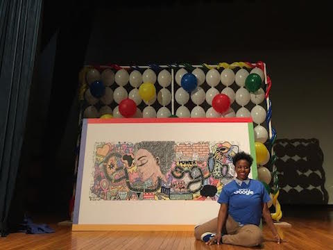 Akilah Johnson posing in front of her My Afrocentric Life work that won 2016 Google Doodle Contest  (Source: Google)