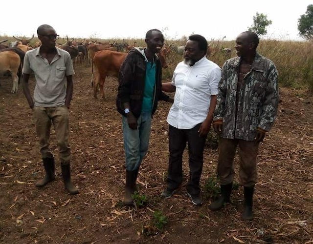 Joseph Kabila with Rwandan workers on his farm