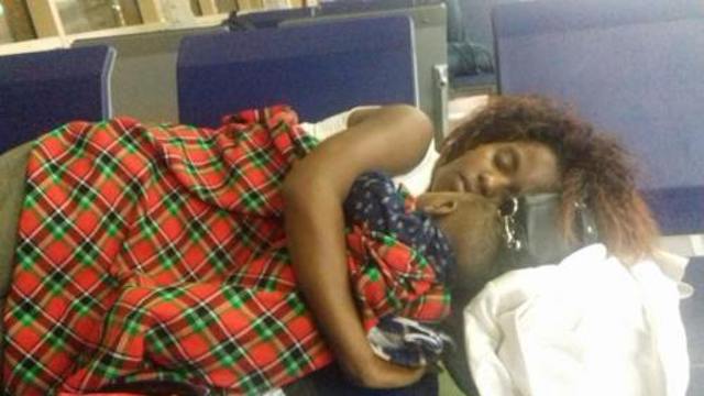 Claudine Nadine Kasinge and her 7-year old baby sleeping in Nairobi Airport, Kenya, boarding room.