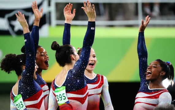 US Women Gymnastics team members Simone Biles, Gabby Douglas, Aly Raisman, Laurie Hernandez and Madison Kocian celebrate the gold
