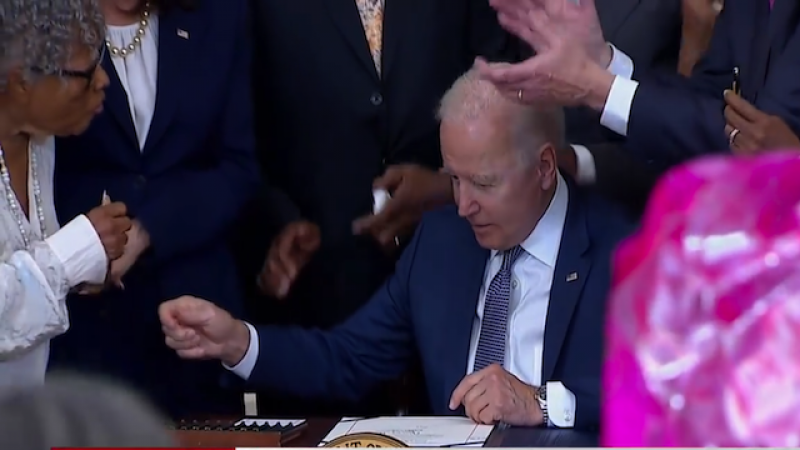  US President Joe Biden signs  the Juneteenth National Holiday bill with  Opal Lee attending, June 17 2021
